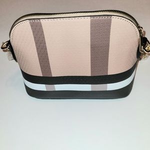 Small cross body chain purse. Brand New. Tan, Brown and Black with a Gold Strap.